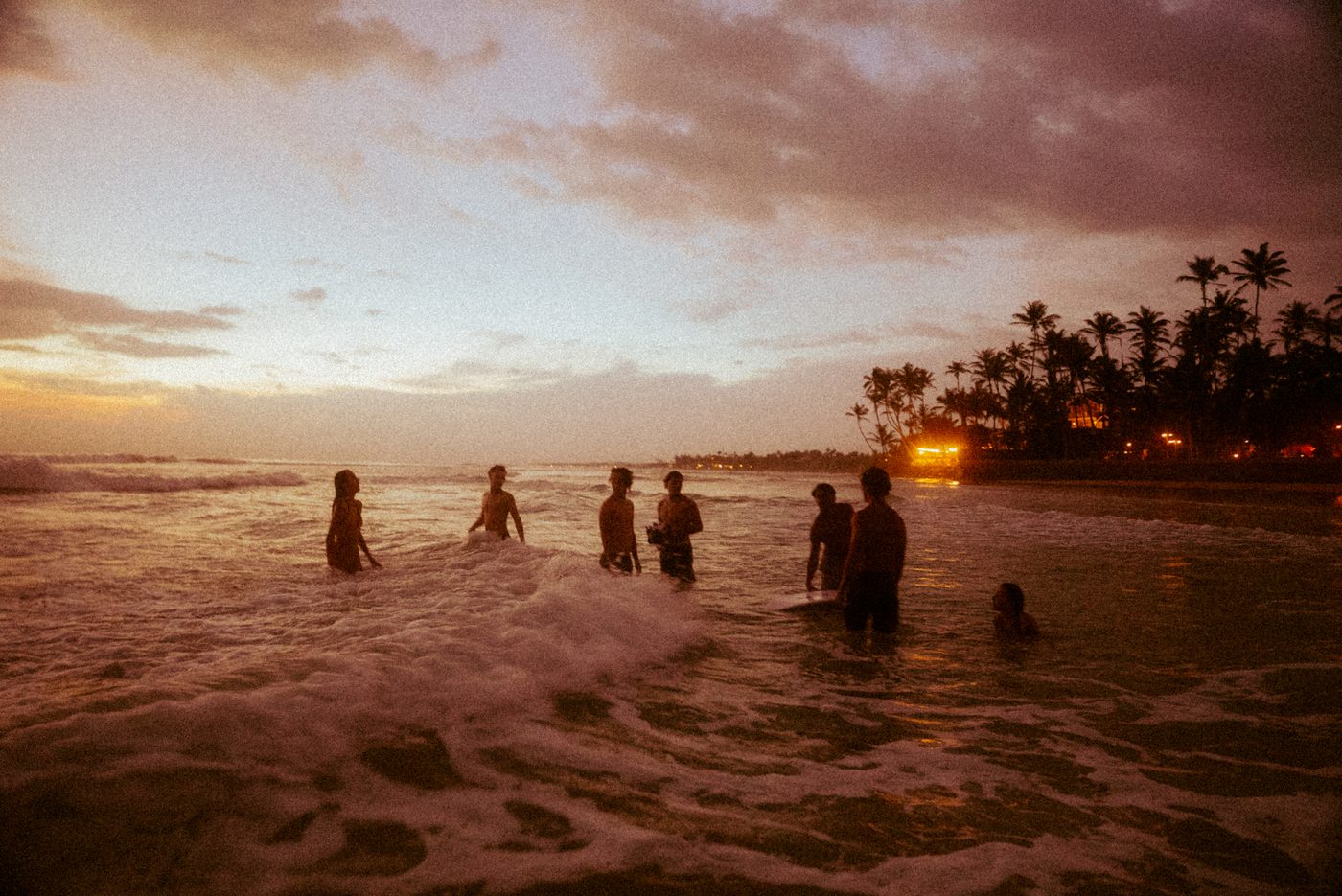 The tribe swimming at sunset in Sri Lanka