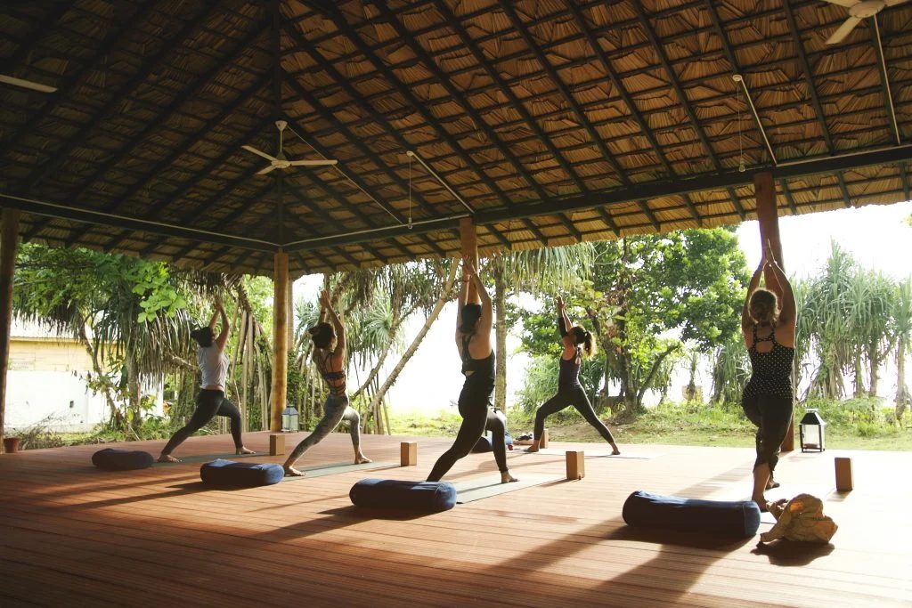 Group yoga session on the deck at the Sri Lanka surf house